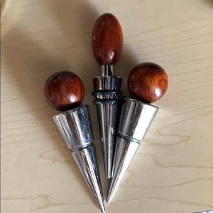 Set of three luxury, wood & silver wine stoppers.
